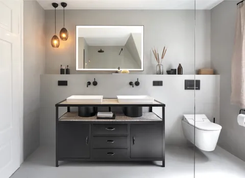 Fugenloses Badezimmer mit wuchtiger Waschtischanlage im industrial Style.